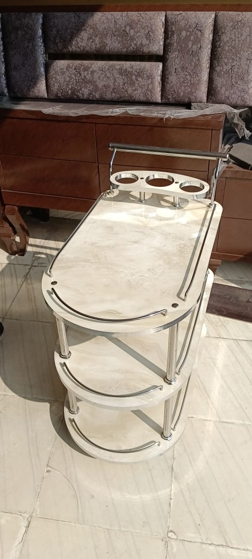 Featuring a pristine ivory high gloss UV wood finish, this trolley brings a touch of elegance and brightness to any space. Ideal for modern interiors seeking a clean and sophisticated look.