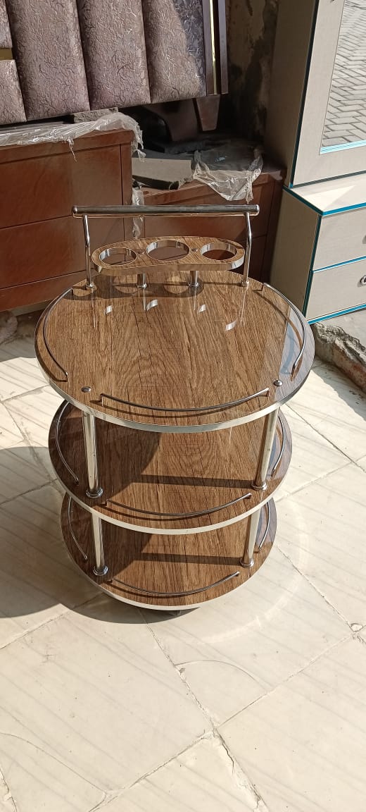 Featuring a pristine ivory high gloss UV wood finish, this trolley brings a touch of elegance and brightness to any space. Ideal for modern interiors seeking a clean and sophisticated look.