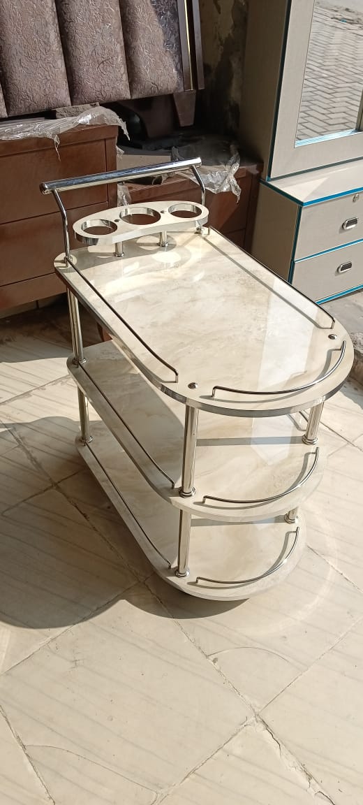 Featuring a pristine ivory high gloss UV wood finish, this trolley brings a touch of elegance and brightness to any space. Ideal for modern interiors seeking a clean and sophisticated look.